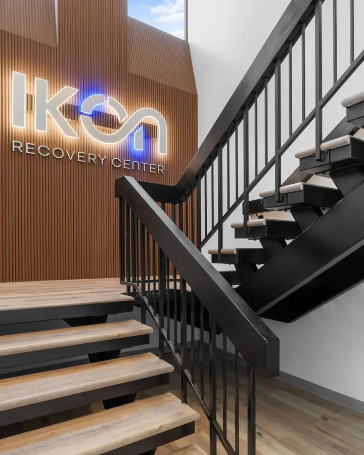 Floating steel and oak staircase at the Ikon Recovery Center commercial build-out